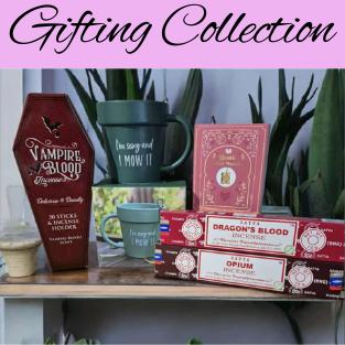 Gifting collection in pink box, image of incense sticks, vampire blood incense, Mug and necklace on shelf with plants