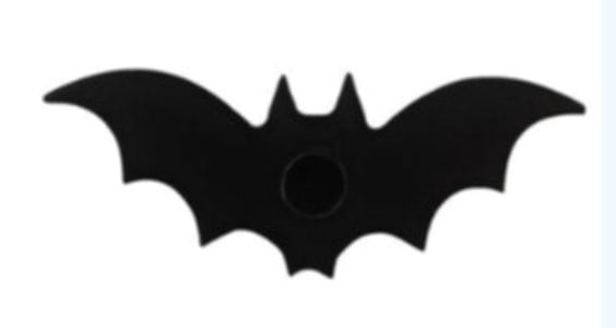 Black bat-shaped object on a white background