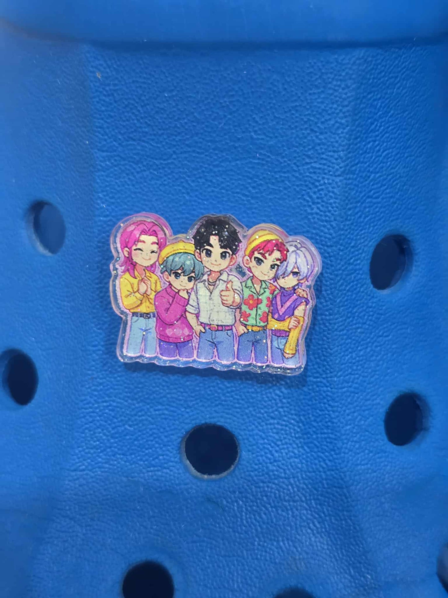 Cartoon character magnet on a blue surface